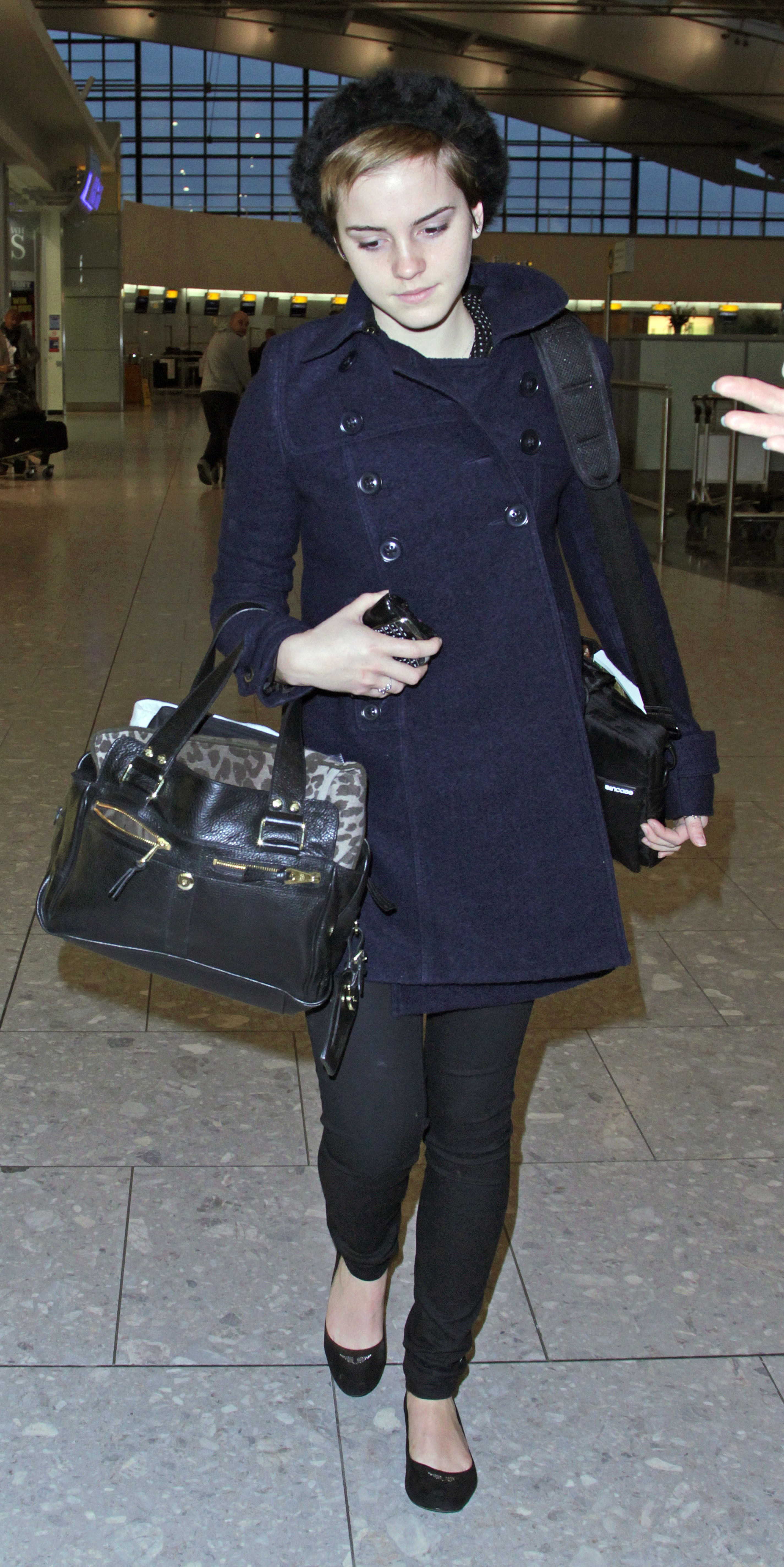 Preppie Emma Watson at Heathrow Airport 1